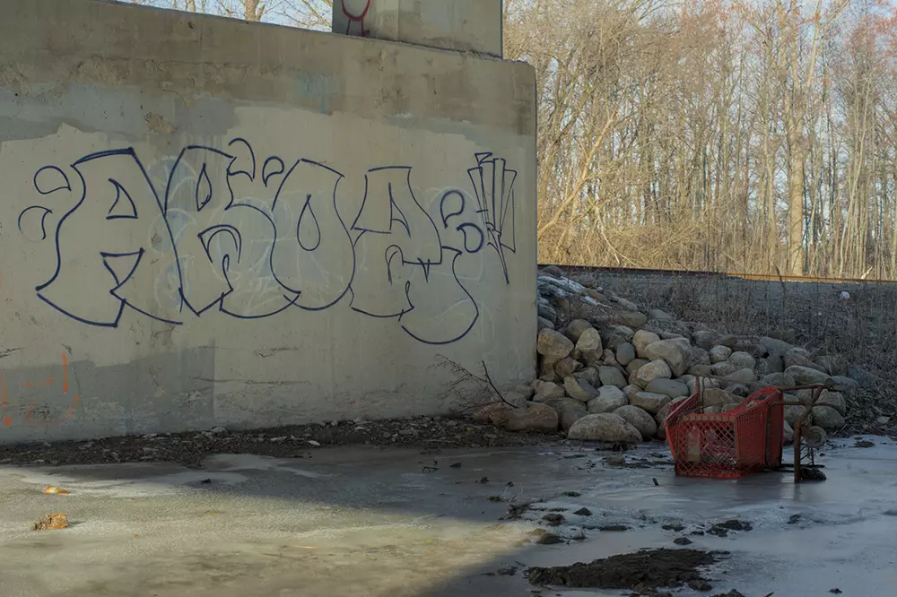 Trash underneath a bridge